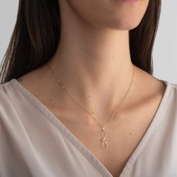 Pingente de Ouro Dezoito Kilates Estetoscópio com Zircônia Verde na Modelo Joiasgold